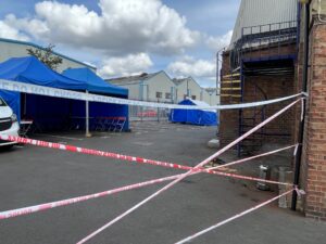 Active Crime Scene at Acton Business Centre cordoned off by police