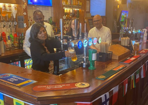 Dr Rupa Huq pulling pints at The Morton Arms
