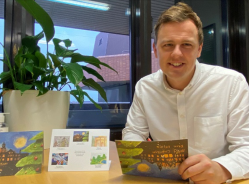 Ealing Council leader Peter Mason with the 2021 winning Christmas cards