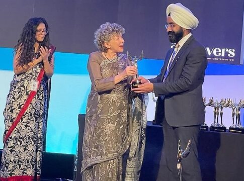 Dr Harmandeep Singh collecting award