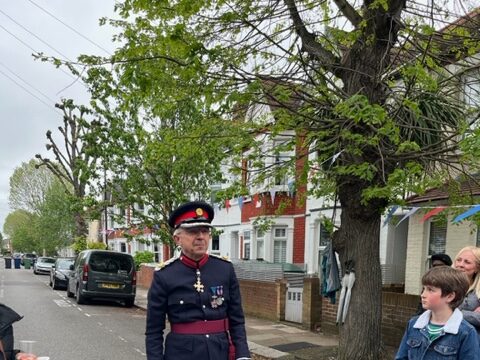 The King's Deputy Lieutenant Richard Kornicki visits Elthorne Park Road to read our a letter from King Charles III and Queen Camilla to residents