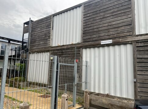 Entry to Marston Court in Hanwell. Entry system has been broken since 2020 and anyone can push gate and gain entry.