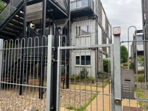 Entry to Marston Court in Hanwell. Entry system has been broken since 2020 and anyone can push gate and gain entry.