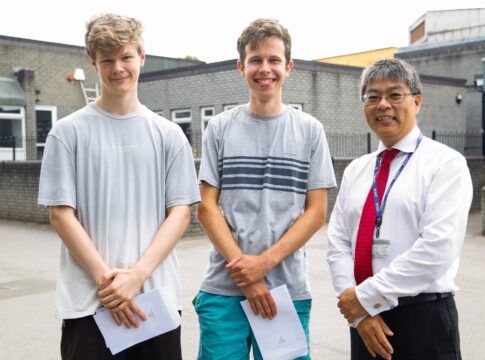 Owen Parfitt-ford and Robin Alsop (left to right), who both scored 4A* grades with Elthorne Park High School headteacher Eliot Wong