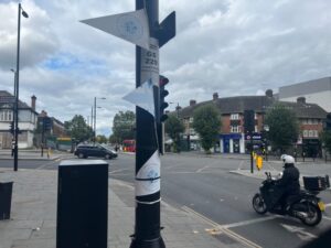 Faded bunting for King Charles III Coronation left up in Greenford Broadway. Photo: EALING.NEWS