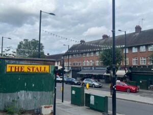 Bunting for King Charles III Coronation left up in Greenford Broadway. Photo: EALING.NEWS