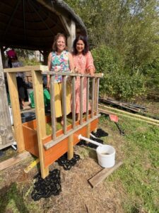 Councillor Amarjit Jammu and Councillor Aysha Raza treading the grapes. Photo: EALING.NEWS