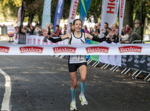 Baxters Loch Ness Marathon. Melissah Gibson female marathon winner over finish line. Photo: Trevor Martin