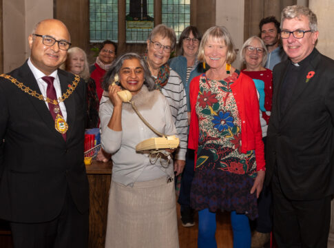 Ealing Charity Christmas Shop are: Ealing Hammersmith and Hounslow branch director Heena Johnson; (on her right) Ealing Mayor, Councillor Hitesh Tailor; (on her left) Sue Green, co-founder the Ealing Charity Christmas Shop and Father Richard Collins, Vicar of Parish Church of Christ the Saviour; along with Card Shop volunteers.Photo: Roger Green