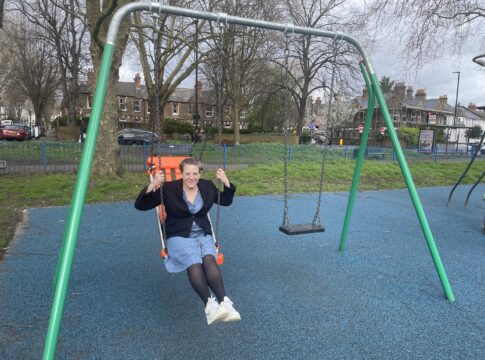 Councillor Polly Knewstub on a swing. Photo: Ealing Council