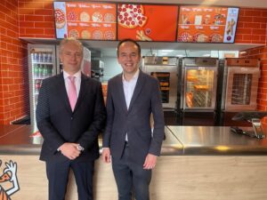 Carlos Vidal, VP International Development Little Caesars and Ealing North MP James Murray. Photo: EALING.NEWS