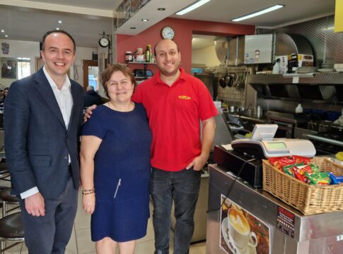James Murray with the owners of Big Boys Cafe. Photo: Ealing Labour