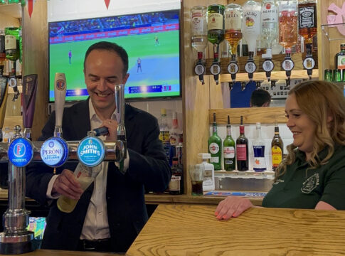 James Murray pulls a pint at The Greenford Arms. Photo: Ealing Labour