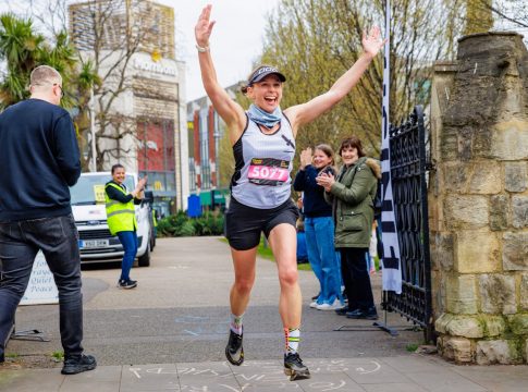 First female finisher Laura Egerton crosses the finish line. Photo: Jake Bush / We Run Ealing