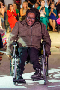 Adrian at Ealing Mencap fashion show. Photo: Ealing Mencap / Fil Mazzarino