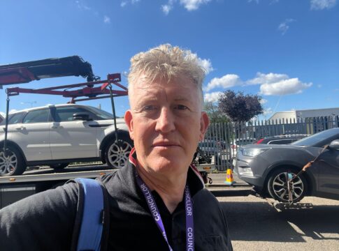 Jonathan Oxley with vehicle being towed away. Photo: Ealing Liberal Democrats