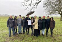 Ealing Council leader Peter Mason (left) & cabinet member for thriving communities Blerina Hashani (right) present the Local Nature Reserve declaration to Katie Boyles, chair of the Brent River Park charity (centre) and members of the Warren Farm Nature Reserve campaign. Photo: Ealing Council