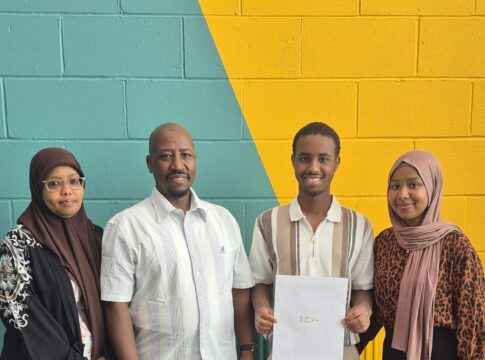 Harun with his family celebrate A level success. Photo: Ark Acton Academy