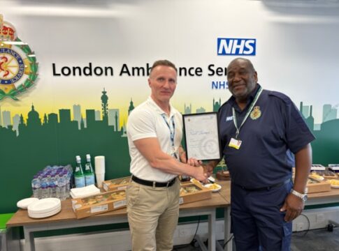 Noel Thomas receives his certificate from chief executive Jason Killens. Photo: London Ambulance Service